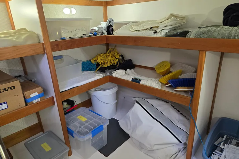Grayson Yacht Photos Pics Storage area on a 2017 Sabre 48 Fly Bridge with cleaning supplies and equipment.
