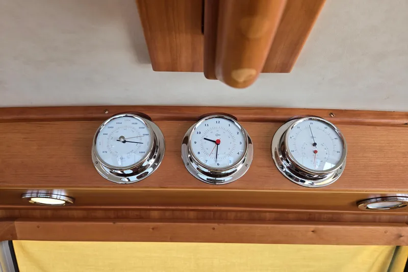Grayson Yacht Photos Pics Gauges on 2017 Sabre 48 Fly Bridge, featuring barometer, clock, and thermometer.