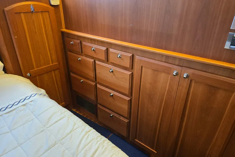 Grayson Yacht Photos Pics Wooden cabinetry in 2017 Sabre 48 Fly Bridge yacht interior, featuring drawers and doors.