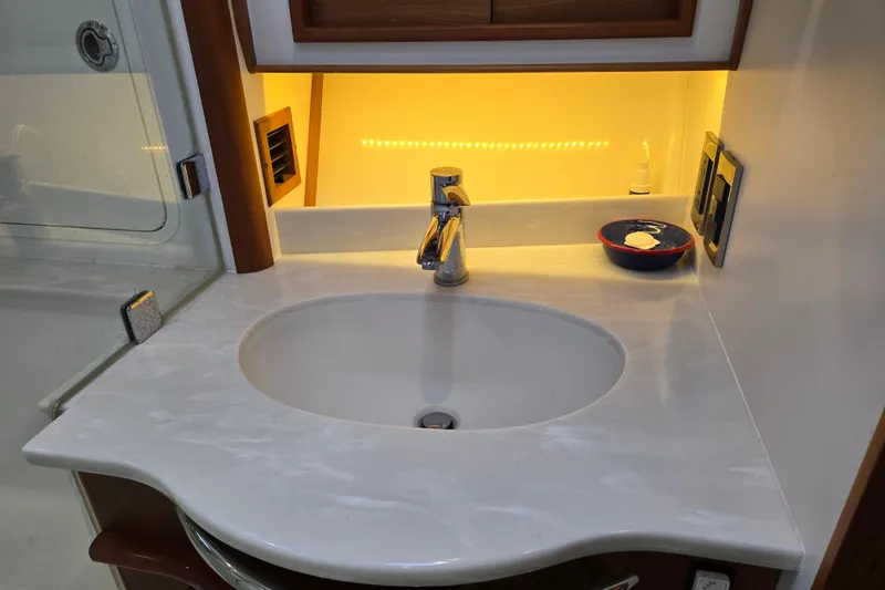 Grayson Yacht Photos Pics Luxurious bathroom sink area on 2017 Sabre 48 Fly Bridge yacht.