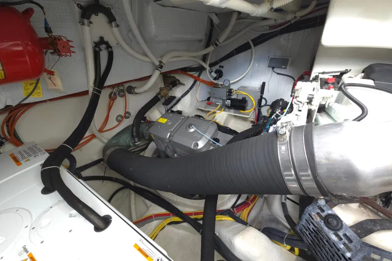 Grayson Yacht Photos Pics Engine room of 2017 Sabre 48 Fly Bridge with visible hoses and wiring.