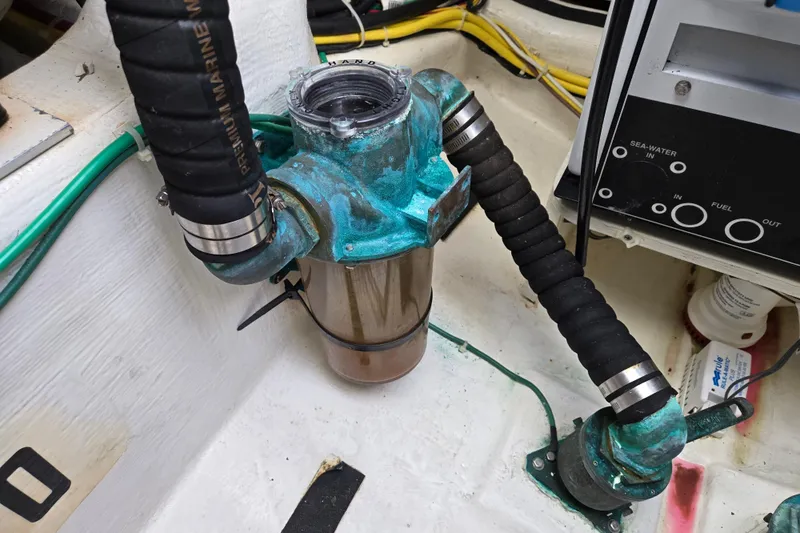 Grayson Yacht Photos Pics Engine compartment of 2017 Sabre 48 Fly Bridge with marine hoses and fittings.