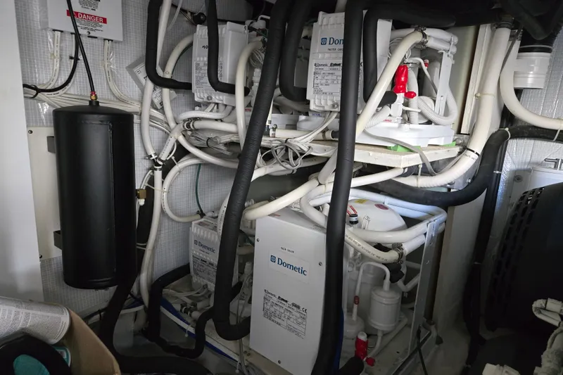 Grayson Yacht Photos Pics Engine room of 2017 Sabre 48 Fly Bridge with Dometic systems and complex piping.