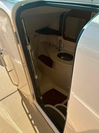  Yacht Photos Pics 2019 Grady-White Freedom 375 boat interior with compact bathroom and sink.