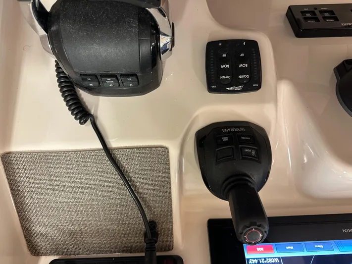  Yacht Photos Pics Control panel of 2019 Grady-White Freedom 375 boat with throttle and joystick.