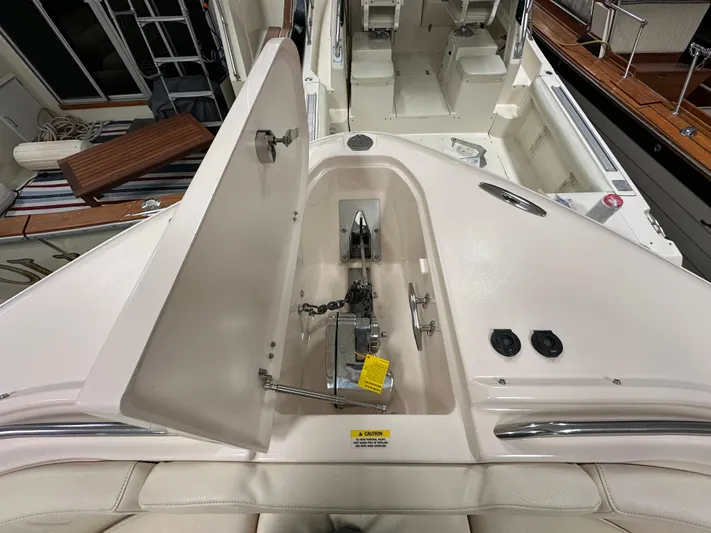  Yacht Photos Pics 2019 Grady-White Freedom 375 boat anchor compartment with open hatch, showcasing interior details.