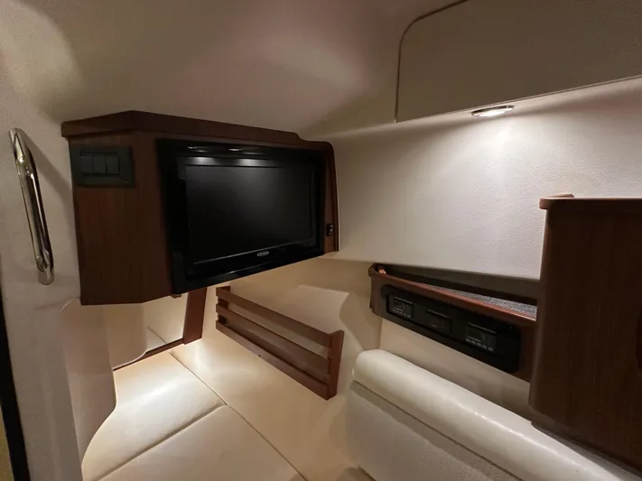  Yacht Photos Pics 2019 Grady-White Freedom 375 cabin interior with TV and seating area.