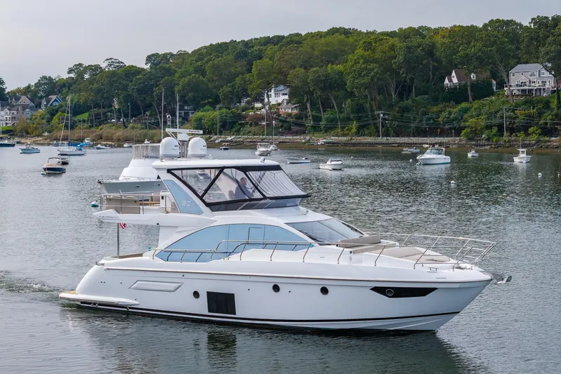  Yacht Photos Pics Luxury Azimut Fly 50 yacht cruising in a scenic harbor, 2020 model.