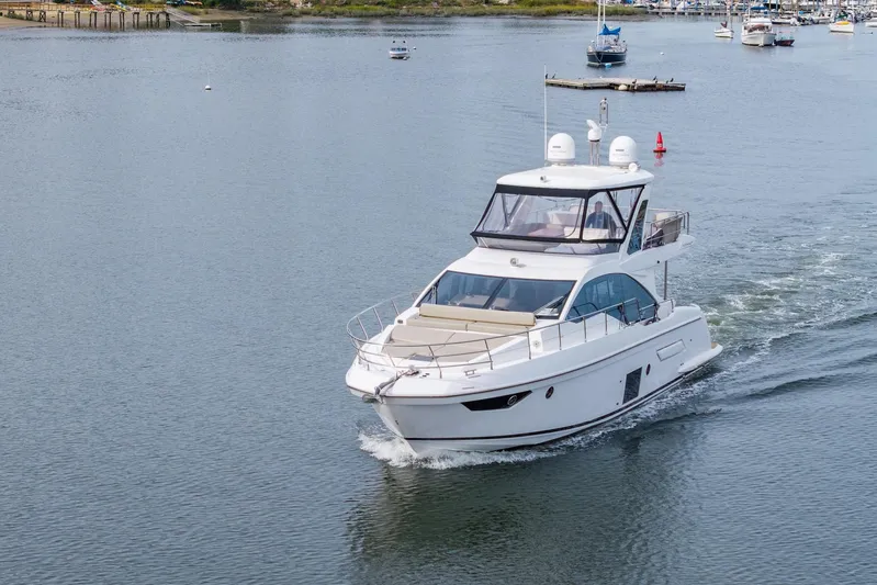  Yacht Photos Pics 2020 Azimut Fly 50 yacht cruising on a calm waterway.