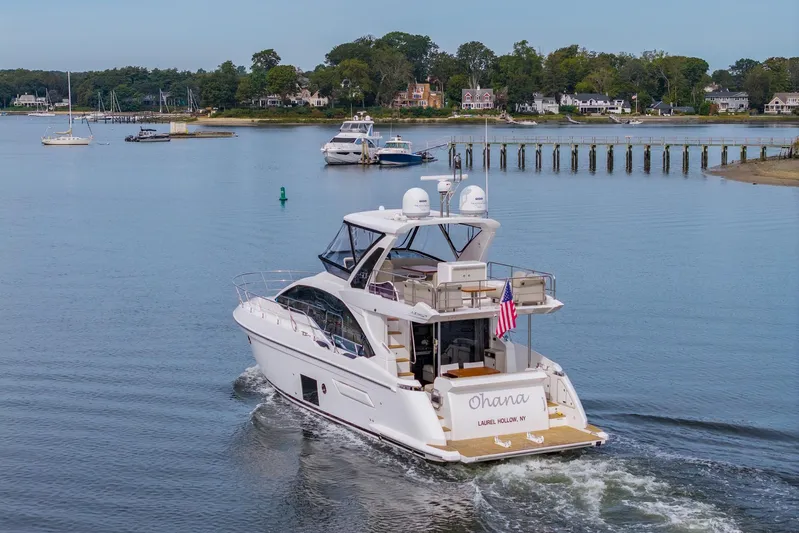  Yacht Photos Pics Azimut Fly 50 yacht cruising in a serene harbor, 2020 model.