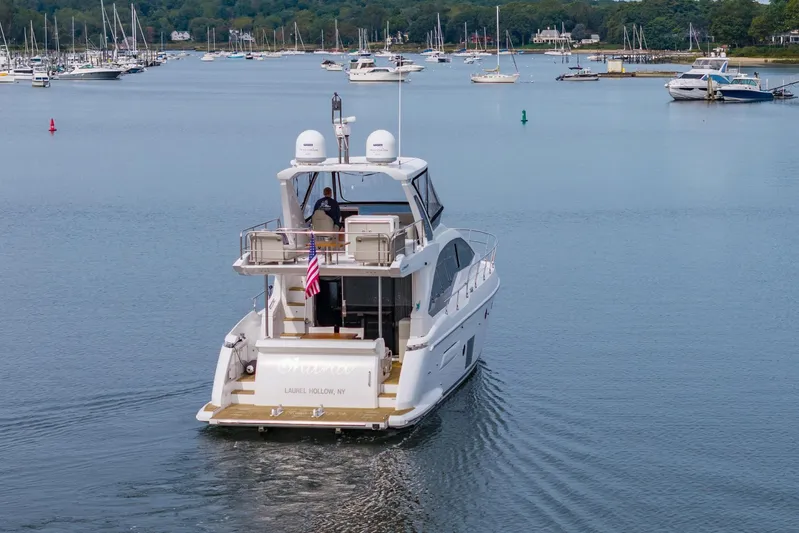  Yacht Photos Pics Azimut Fly 50 yacht cruising in a serene harbor, 2020 model.