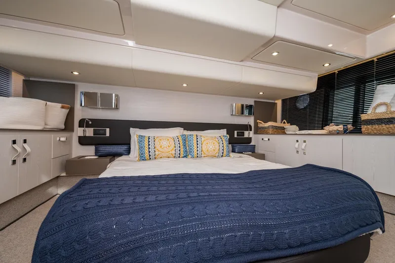  Yacht Photos Pics Luxurious Azimut Fly 50 yacht bedroom interior, 2020 model, featuring elegant decor and cozy bedding.
