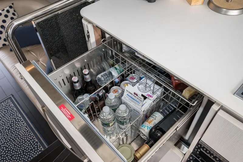  Yacht Photos Pics Beverage drawer on 2020 Azimut Fly 50 yacht, stocked with drinks and water bottles.