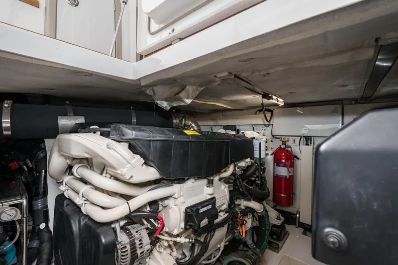  Yacht Photos Pics Engine room of 2020 Azimut Fly 50 yacht, featuring modern equipment and fire extinguisher.