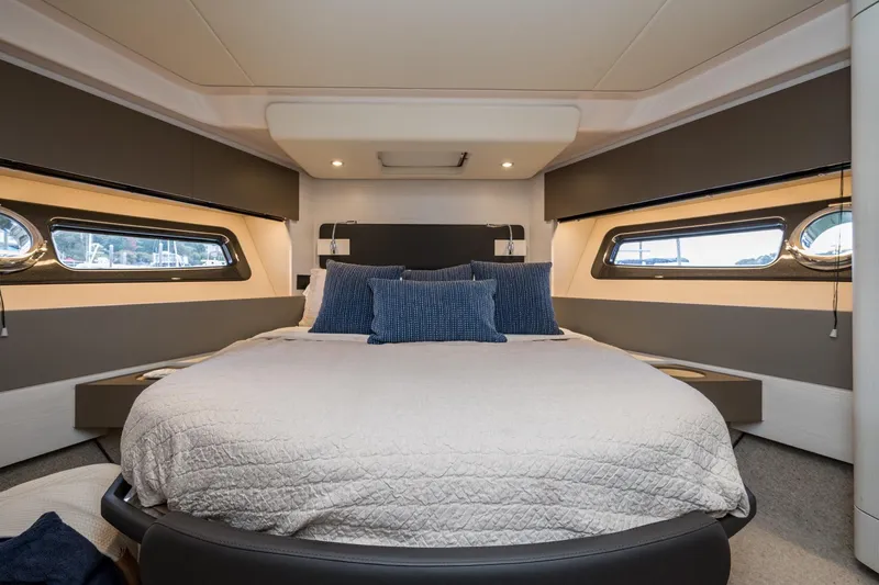  Yacht Photos Pics Luxurious bedroom interior of 2020 Azimut Fly 50 yacht with modern design and cozy bedding.