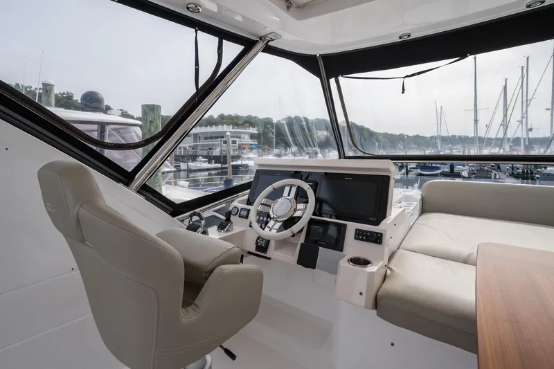  Yacht Photos Pics Interior view of 2020 Azimut Fly 50 yacht cockpit with modern controls and seating.