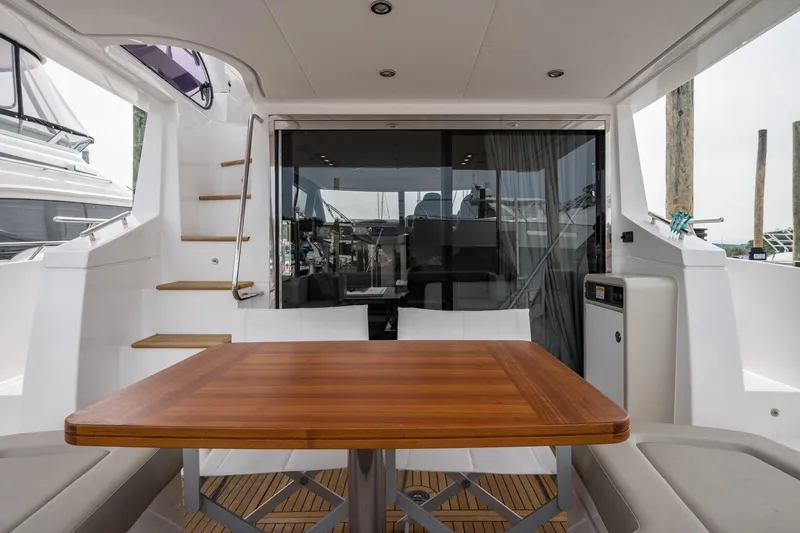  Yacht Photos Pics Azimut Fly 50 yacht interior, featuring a wooden table and modern design, 2020 model.