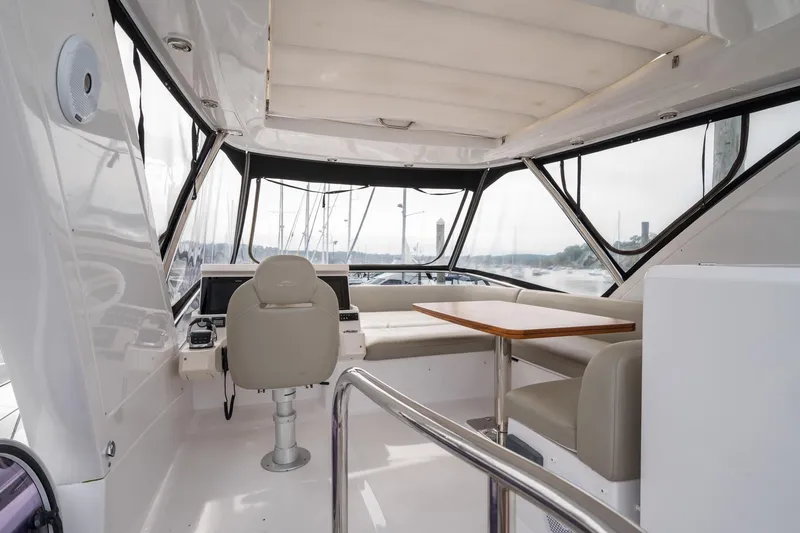  Yacht Photos Pics Interior of 2020 Azimut Fly 50 yacht with helm, seating, and table.