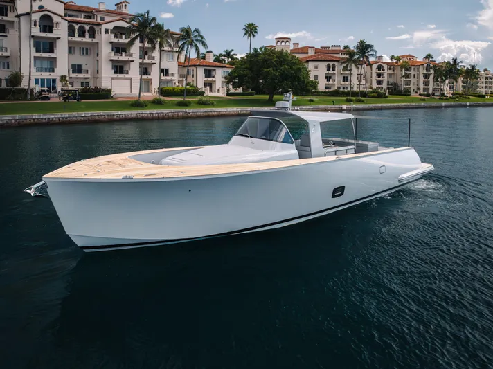 M/y Valor Yacht Photos Pics Luxury Alen 55 yacht cruising near waterfront residences, 2021 model.