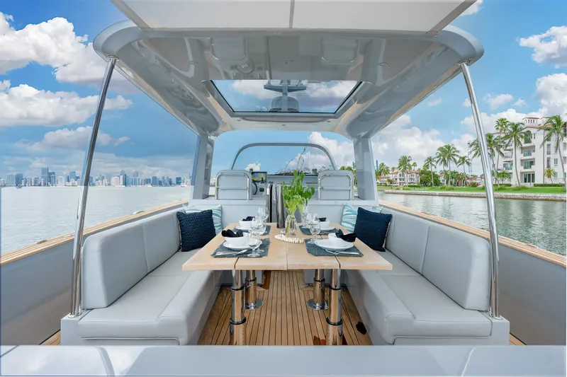 M/y Valor Yacht Photos Pics Luxury Alen 55 yacht interior with elegant dining setup, 2021 model, ocean view.