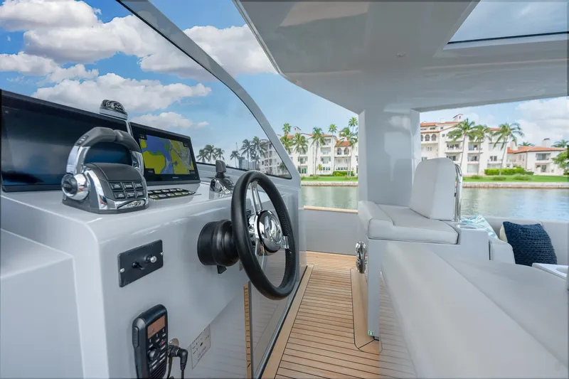 M/y Valor Yacht Photos Pics Interior view of 2021 Alen 55 yacht with modern navigation equipment and luxurious seating.