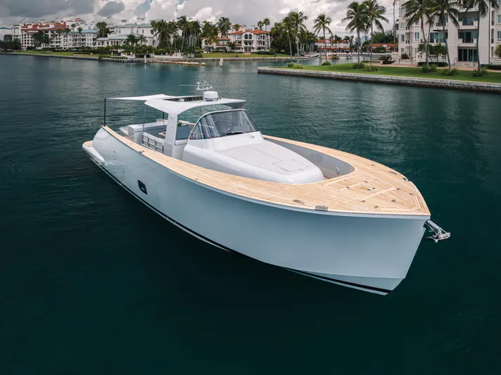 M/y Valor Yacht Photos Pics 2021 Alen 55 yacht cruising near waterfront homes and palm trees.