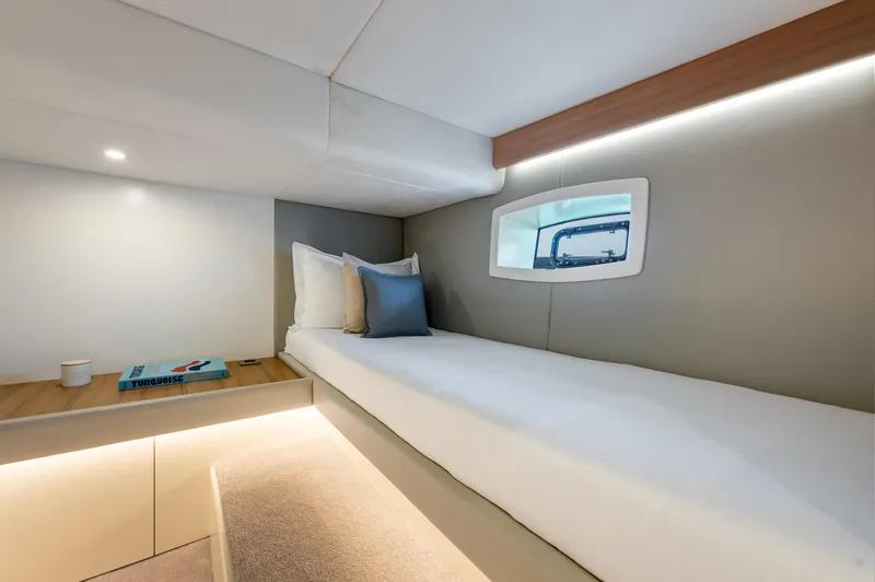 M/y Valor Yacht Photos Pics Modern cabin interior of 2021 Alen 55 yacht with single bed and window.