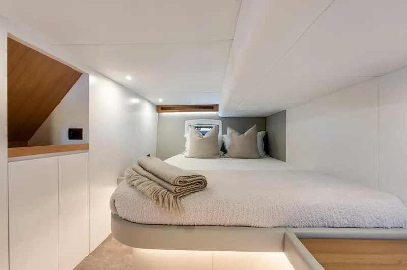 M/y Valor Yacht Photos Pics Luxurious cabin interior of 2021 Alen 55 yacht with cozy bedding and modern design.