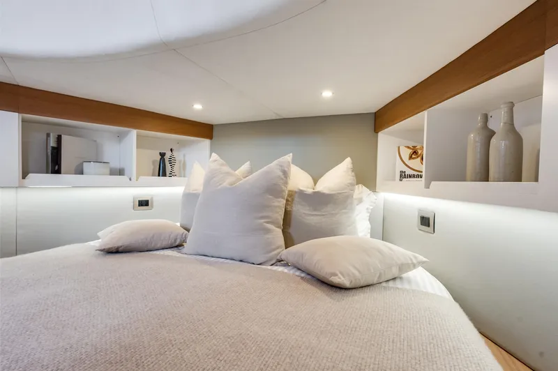 M/y Valor Yacht Photos Pics Luxurious bedroom interior of 2021 Alen 55 yacht with plush bedding and modern decor.