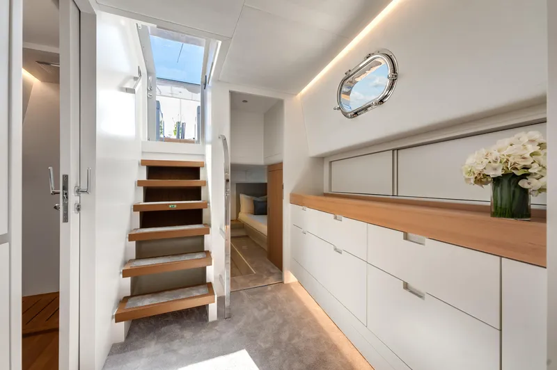 M/y Valor Yacht Photos Pics Luxurious interior of 2021 Alen 55 yacht with modern design and elegant staircase.