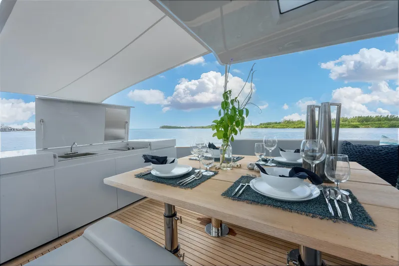 M/y Valor Yacht Photos Pics Luxurious dining setup on Alen 55 yacht, 2021 model, with ocean view.
