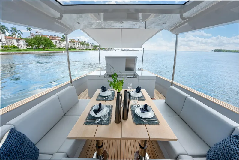 M/y Valor Yacht Photos Pics Luxury dining setup on Alen 55 yacht, 2021 model, with ocean view.