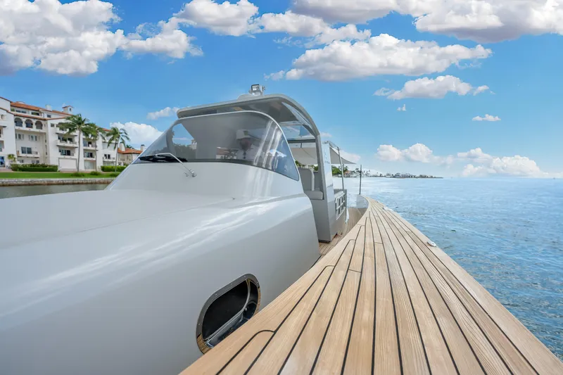 M/y Valor Yacht Photos Pics 2021 Alen 55 yacht on serene water with clear blue sky.