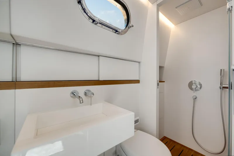 M/y Valor Yacht Photos Pics Modern bathroom interior in 2021 Alen 55 yacht, featuring sleek sink and shower design.
