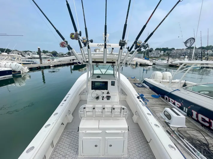 Helm Master Ex Joystick Yacht Photos Pics Regulator 32FS boat helm with joystick, fishing rods, and Garmin equipment at marina, 2006 model.