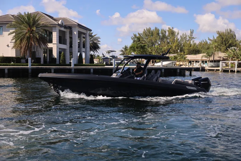 2025 Skipper 34 Twin 300 V8 Yacht Photos Pics Skipper-BSK 34 boat cruising near waterfront homes, 2025 model.