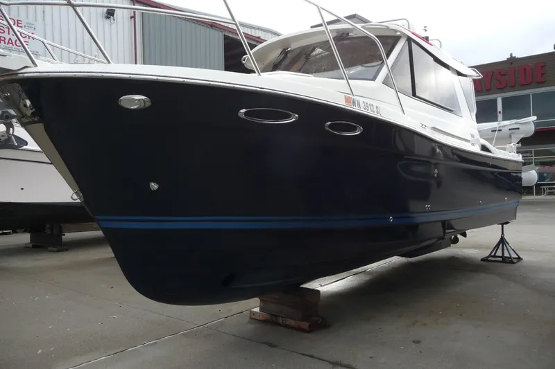  Yacht Photos Pics 2017 Cutwater C28 boat on dry dock, showcasing sleek design and modern features.