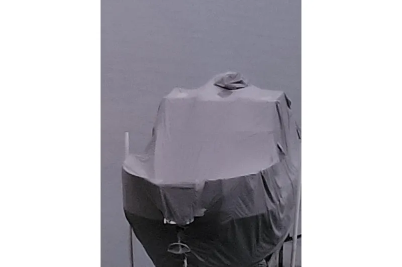  Yacht Photos Pics Covered 2017 Cutwater C28 boat on water, gray tarp protection.