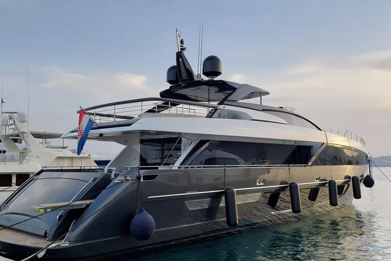 Ruzarija Yacht Photos Pics 2020 Riva 100' Corsaro luxury yacht docked at sunset.