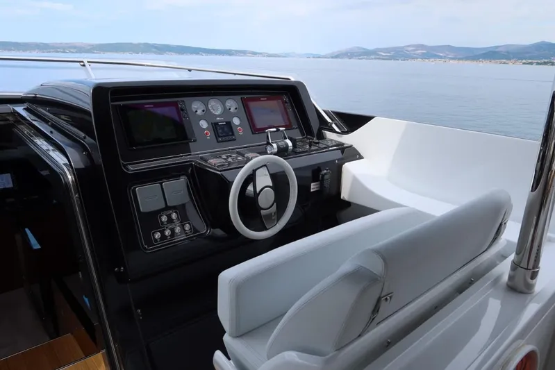 Ruzarija Yacht Photos Pics Helm of 2020 Riva 100' Corsaro yacht with modern navigation controls.