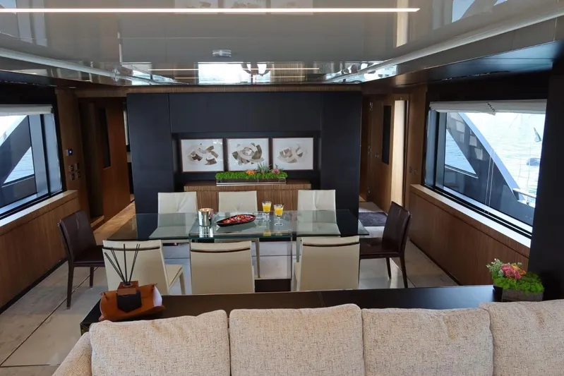 Ruzarija Yacht Photos Pics Luxurious interior of 2020 Riva 100' Corsaro yacht with elegant dining area and modern decor.
