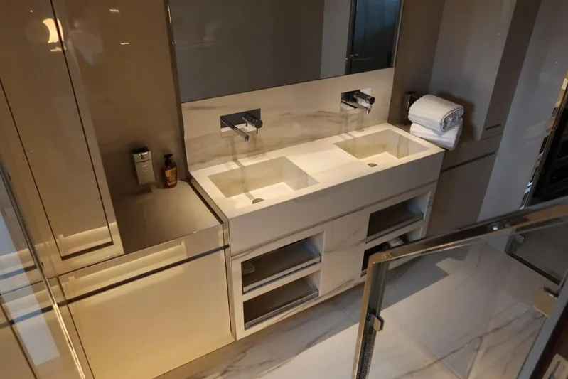 Ruzarija Yacht Photos Pics Luxurious bathroom interior on 2020 Riva 100' Corsaro yacht with dual sinks and modern design.