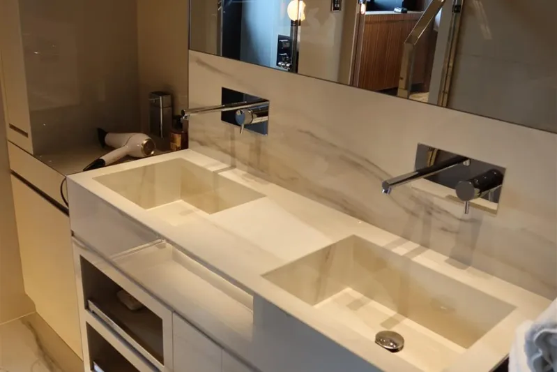 Ruzarija Yacht Photos Pics Luxurious bathroom vanity on Riva 100' Corsaro yacht, featuring dual sinks and modern fixtures.