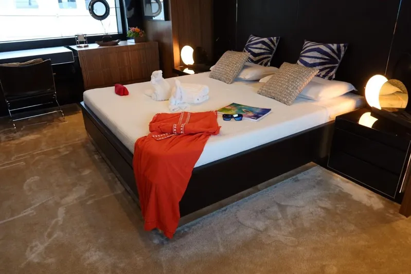 Ruzarija Yacht Photos Pics Luxurious bedroom interior on 2020 Riva 100' Corsaro yacht, featuring elegant decor and modern furnishings.