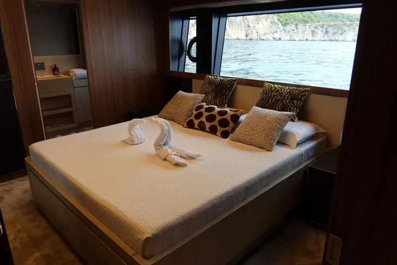 Ruzarija Yacht Photos Pics Luxurious bedroom on 2020 Riva 100' Corsaro yacht with ocean view and elegant decor.