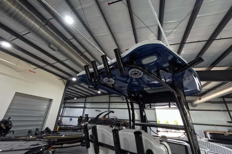  Yacht Photos Pics 2024 Tidewater boat in a warehouse, showcasing its sleek design and modern features.