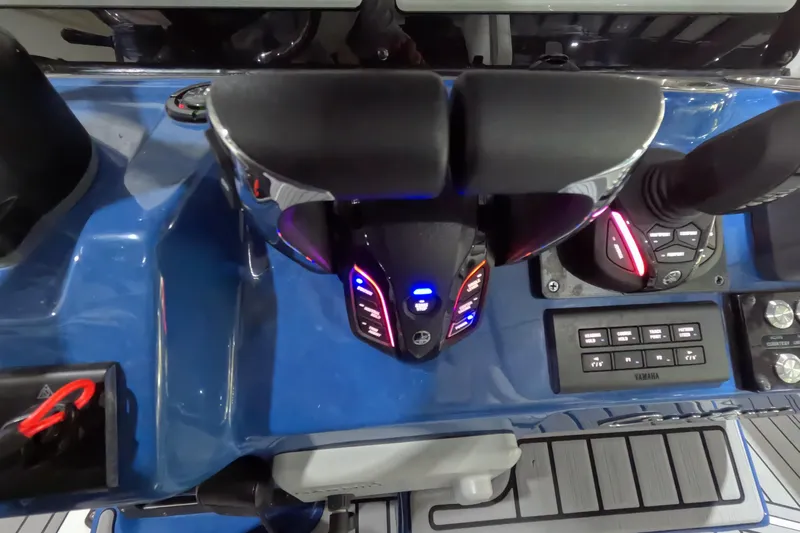  Yacht Photos Pics 2024 Tidewater boat control panel with illuminated throttle and navigation controls.