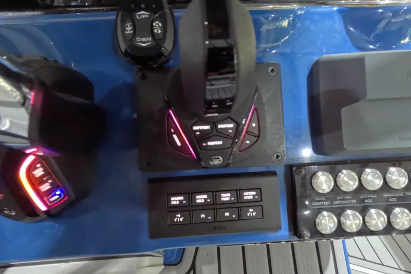  Yacht Photos Pics 2024 Tidewater boat control panel with illuminated buttons and switches.