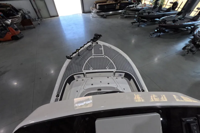  Yacht Photos Pics 2024 Tidewater boat interior in showroom, featuring sleek design and modern equipment.