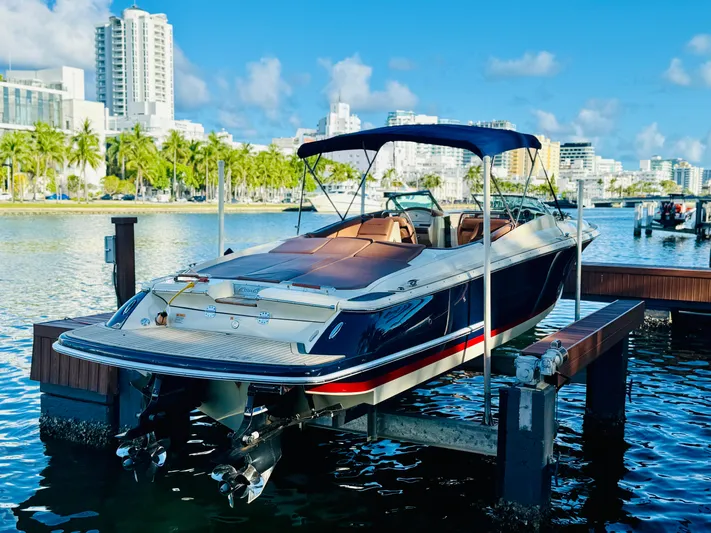  Yacht Photos Pics 2015 Chris-Craft Launch 32 boat docked in a sunny marina setting.